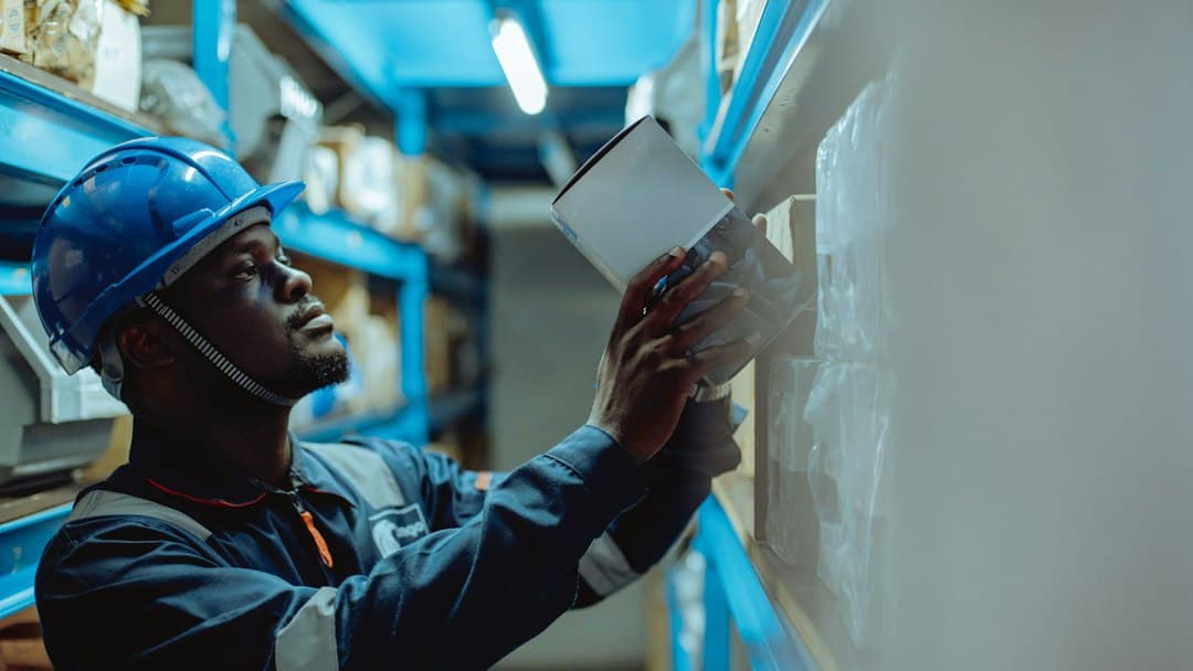 Engineer in a hard hat checking details on site